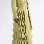 The Kinetic Tailored Coat: A chic, cozy coat which features our signature wave details