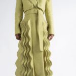 The Kinetic Tailored Coat: A chic, cozy coat which features our signature wave details